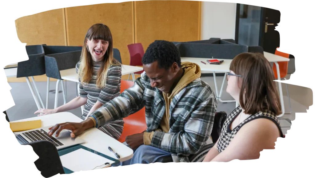 Three disabled friends laughing together